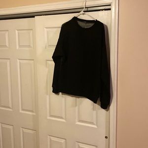 A black sweatshirt with a sheer back.